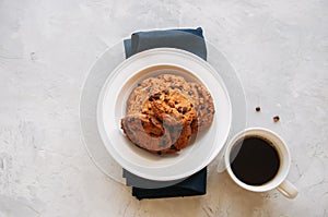 American chocolate chip cookies in a white plate cup of coffee