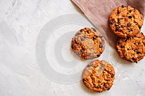 American chocolate chip cookies on a white stone background. Top