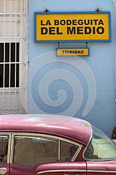 American classic car in front of Bodeguita del Medio in Trinidad, Cuba