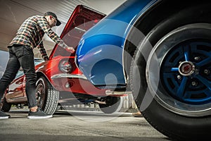 American Classic Cars Enthusiast Working on His Vehicle