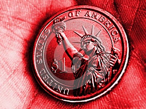 American coin lies in the palm. 1 dollar close-up. Bright red tinted illustration in Republican Party GOP color. Vivid and catchy photo