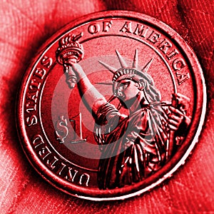 American coin lies in the palm. 1 dollar close-up. Red square tinted illustration in Republican Party GOP color. Bright and catchy photo