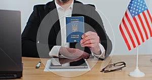 American consular officer showing Ukrainian passport immigrant, work visa, citizenship. Visa Application online form