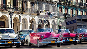 American convertible vintage cars parked on the main street in Havana Cuba