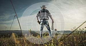American Cowboy Supervise His Countryside Farmland photo