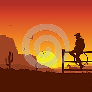 American Cowboy on wild west sunset landscape in the evening