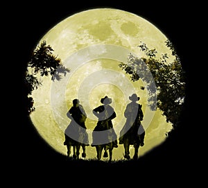 Three Cowboys Under The Moonrise photo