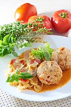 American cuisine. Pasta with meatballs and basil with sauce