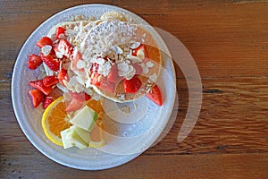 American Dessert - Pancake banana and strawberry fruit with honey caramel - Closeup scene - Breakfast food on coffee cafe