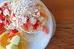 American Dessert - Pancake banana and strawberry fruit with honey caramel - Closeup scene - Breakfast food on coffee cafe