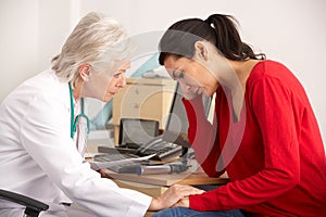 American doctor with depressed woman patient