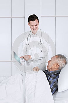 American doctor shows medical reports his patient