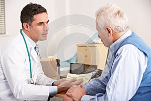 American doctor talking to man in surgery