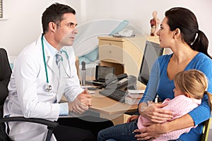 American doctor talking to worried mother