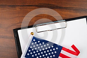 American document, mockup for text on clipboard, white sheet of paper in a folder for notes with usa flag