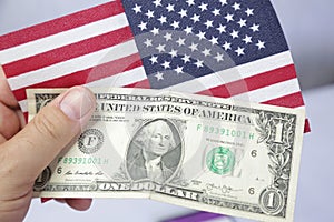 1 american dollar bill with united states flag .