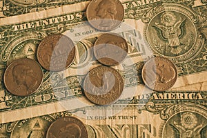 American dollar bills and coins as background for design. Heap of American dollars close up view.