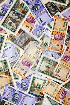 American dollar and Indian banknote backgrounds.