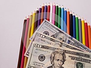 American dollar money and color pencils on the white background