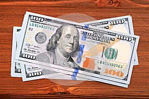 American dollars banknotes on wooden table