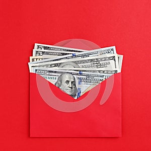 American dollars in cash in red envelope on bright minimal style background Money mail concept.