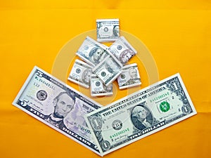 American dollars on orange bright background photo