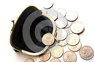 American dollars in a coin purse on a white background. Close-up. The concept of saving money in crisis and home finance, savings.