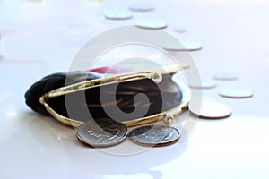 American dollars in a coin purse on a white background. Close-up.