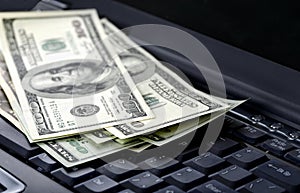 American dollars on laptop