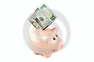 American dollars and piggy bank isolated on white