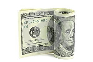 American dollars rolled in a roll
