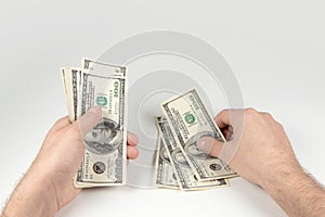 American dollars or US dollars: hand counting one hundred American money or 100 USD