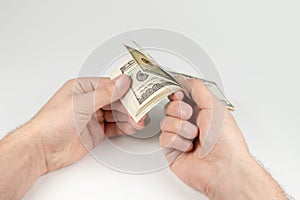 American dollars or US dollars: hand counting one hundred American money or 100 USD