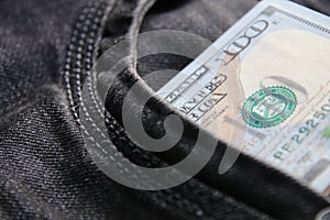 American dollars USD banknotes in jeans pocket.