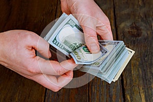 American dollars in a women hands.