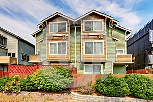 American duplex house for two families. Green exterior paint