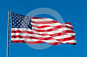 American flag against a blue sky.