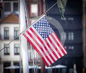 American Flag Against City Background