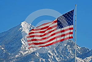 American Flag Against Snowy Utah Mountain