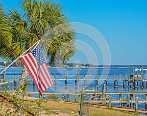 The American Flag along the shoreline of Hammock Bay in Freeport, Walton County, Florida