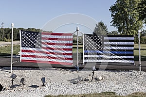 American flag alongside a Thin Blue Line flag honoring the US and Law Enforcement officers