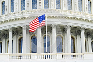 American flag on the background of the Capitol