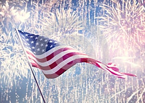 American flag on background of fireworks.