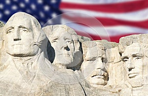 American flag behind Mount Rushmore