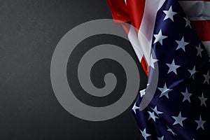 American flag on a black background with an empty space for writing text. The symbol of America. A template for a holiday