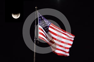 American Flag blowing in the night sky