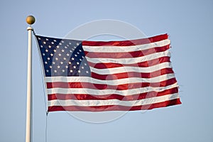 American flag blows in the wind by the ocean in Newport, Rhode Island