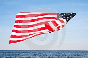 American flag on blue sky. USA Independence day, 4th July. United States flag