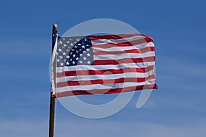 American flag in a bright blue sky