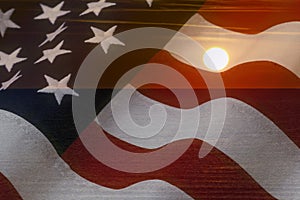 American flag and bright sunshine on ocean. USA patriotic concept